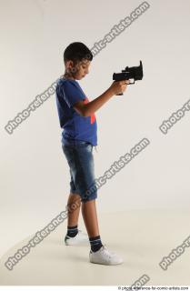 TIMBO STANDING POSE WITH GUN